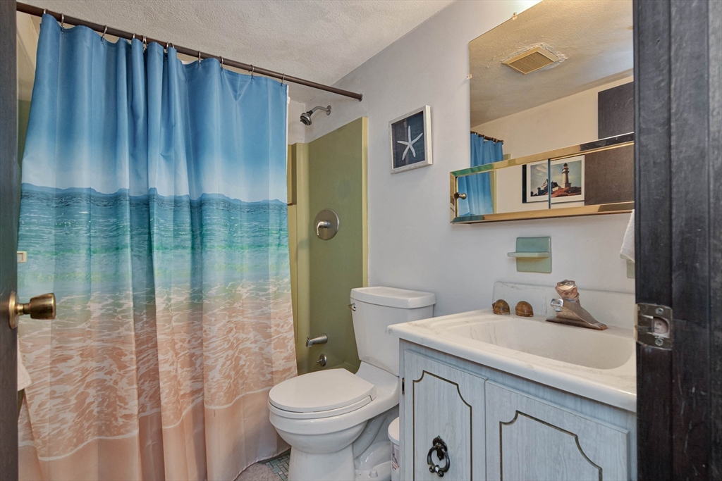 294 Codman Hill Road, Unit 33F Boxborough, MA 01719 - Photo 6 of 31 a bathroom with a sink toilet and shower