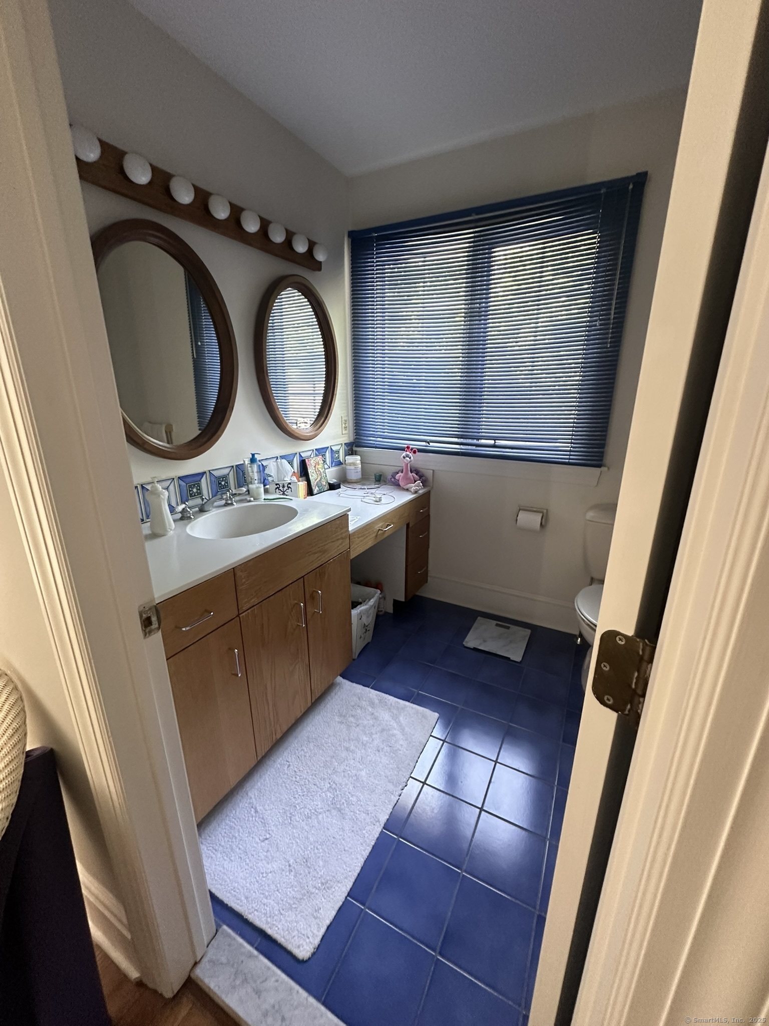57 Castle Meadow Road Newtown, CT 06470 - Photo 13 of 21 a kitchen with wooden cabinets a sink and a stove