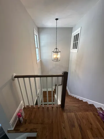 a view of a bedroom and wooden floor