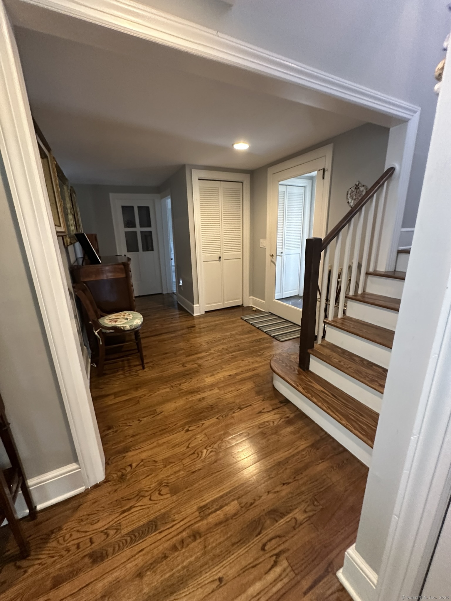 57 Castle Meadow Road Newtown, CT 06470 - Photo 18 of 21 a view of a livingroom with wooden floor and stairs