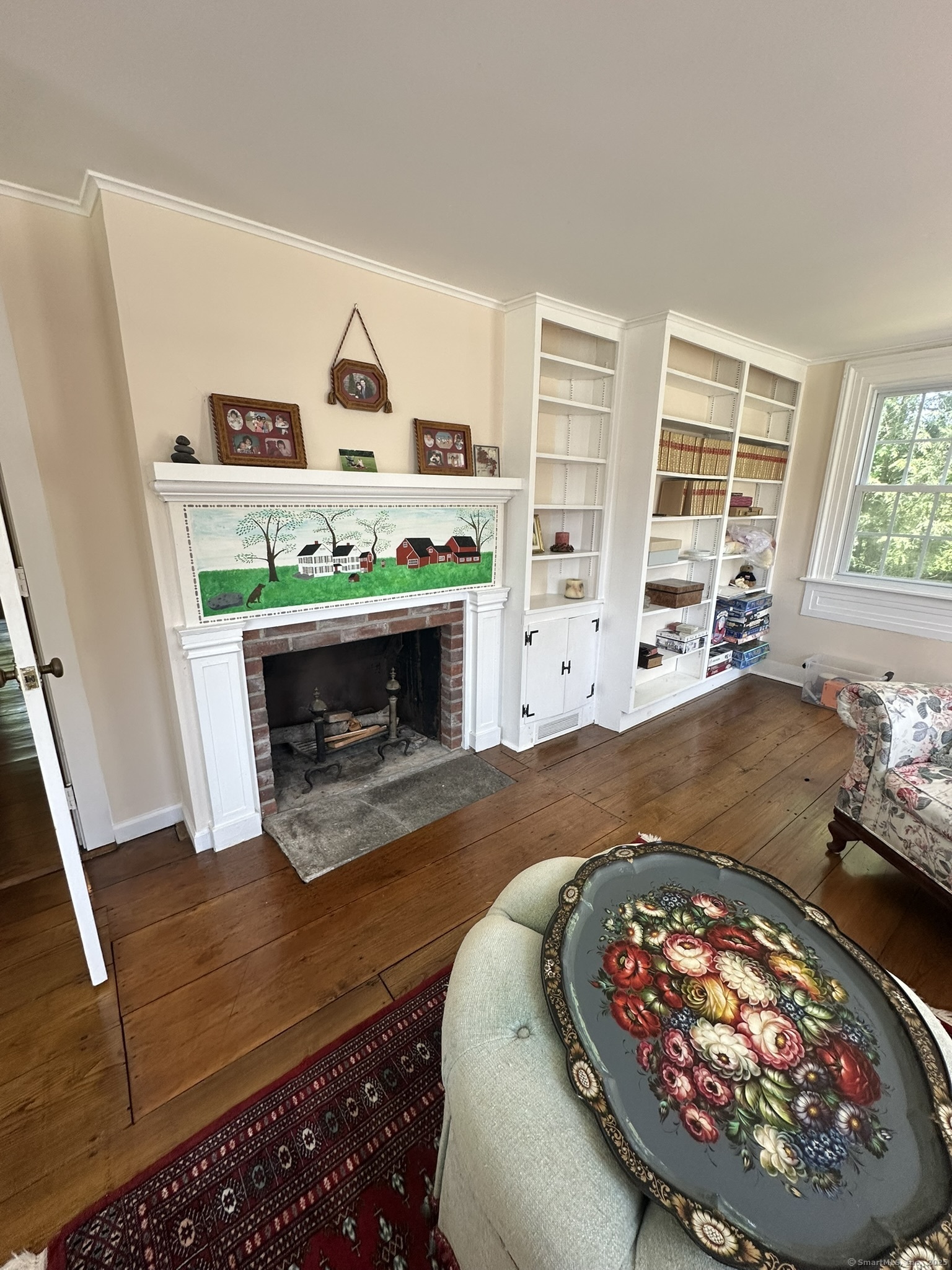 57 Castle Meadow Road Newtown, CT 06470 - Photo 20 of 21 a living room with furniture and a fireplace