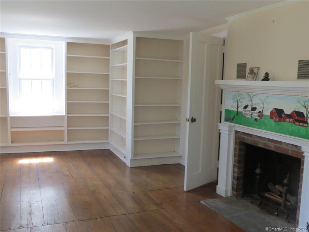 57 Castle Meadow Road Newtown, CT 06470 - Photo 5 of 21 a living room with furniture and a fireplace