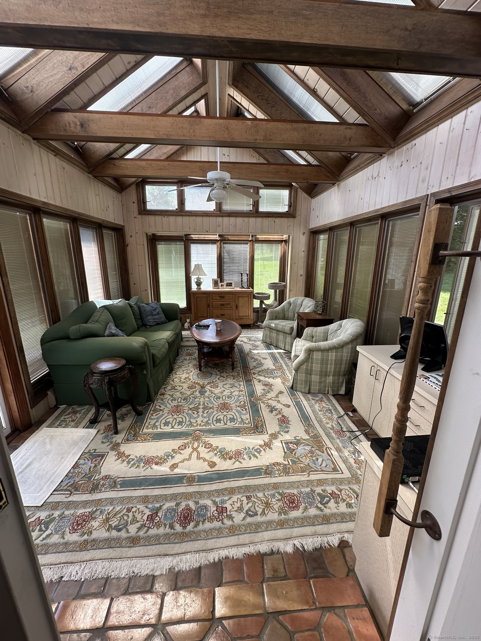 57 Castle Meadow Road Newtown, CT 06470 - Photo 10 of 21 a living room with furniture and a chandelier