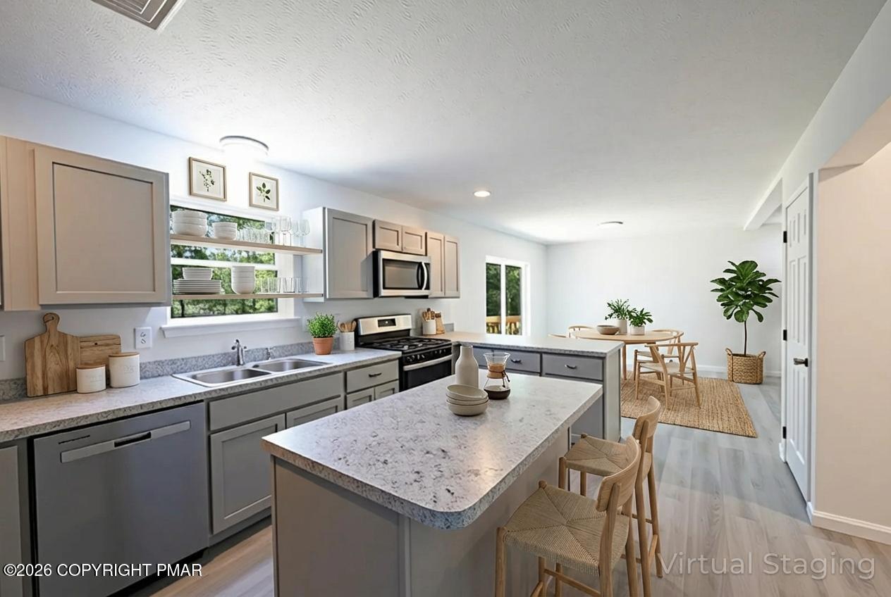 1125 Glouster Road, Unit 3209 Tobyhanna, PA 18466 - Photo 13 of 53 a kitchen with a sink stove and cabinets