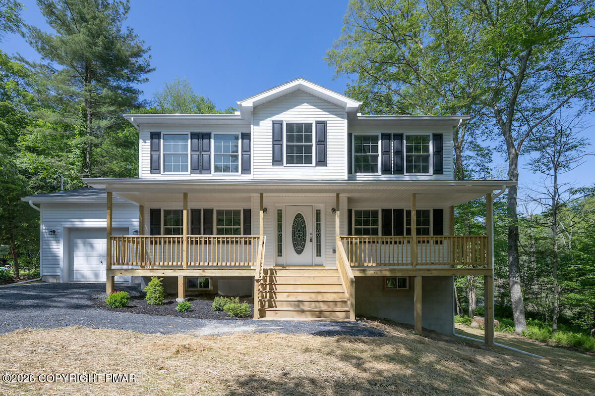 1125 Glouster Road, Unit 3209 Tobyhanna, PA 18466 - Photo 2 of 53 a front view of a house with a yard and trees