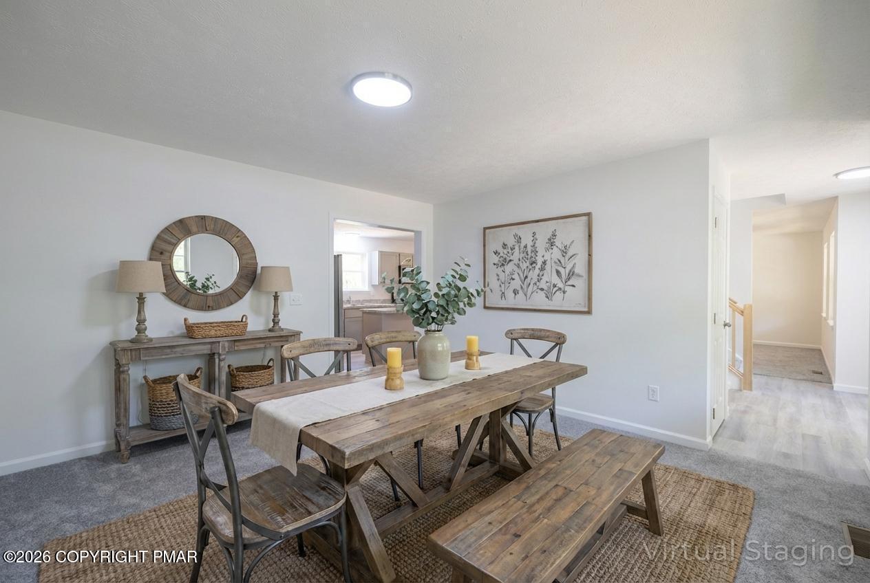 1125 Glouster Road, Unit 3209 Tobyhanna, PA 18466 - Photo 26 of 53 a view of a dining room with furniture and wooden floor