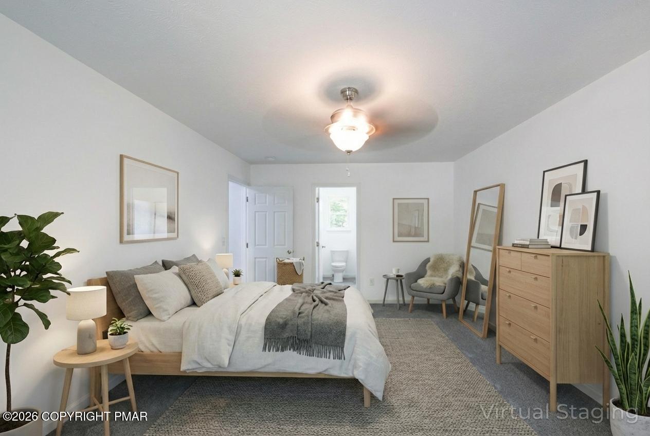 1125 Glouster Road, Unit 3209 Tobyhanna, PA 18466 - Photo 31 of 53 a spacious bedroom with a bed and ceiling fan