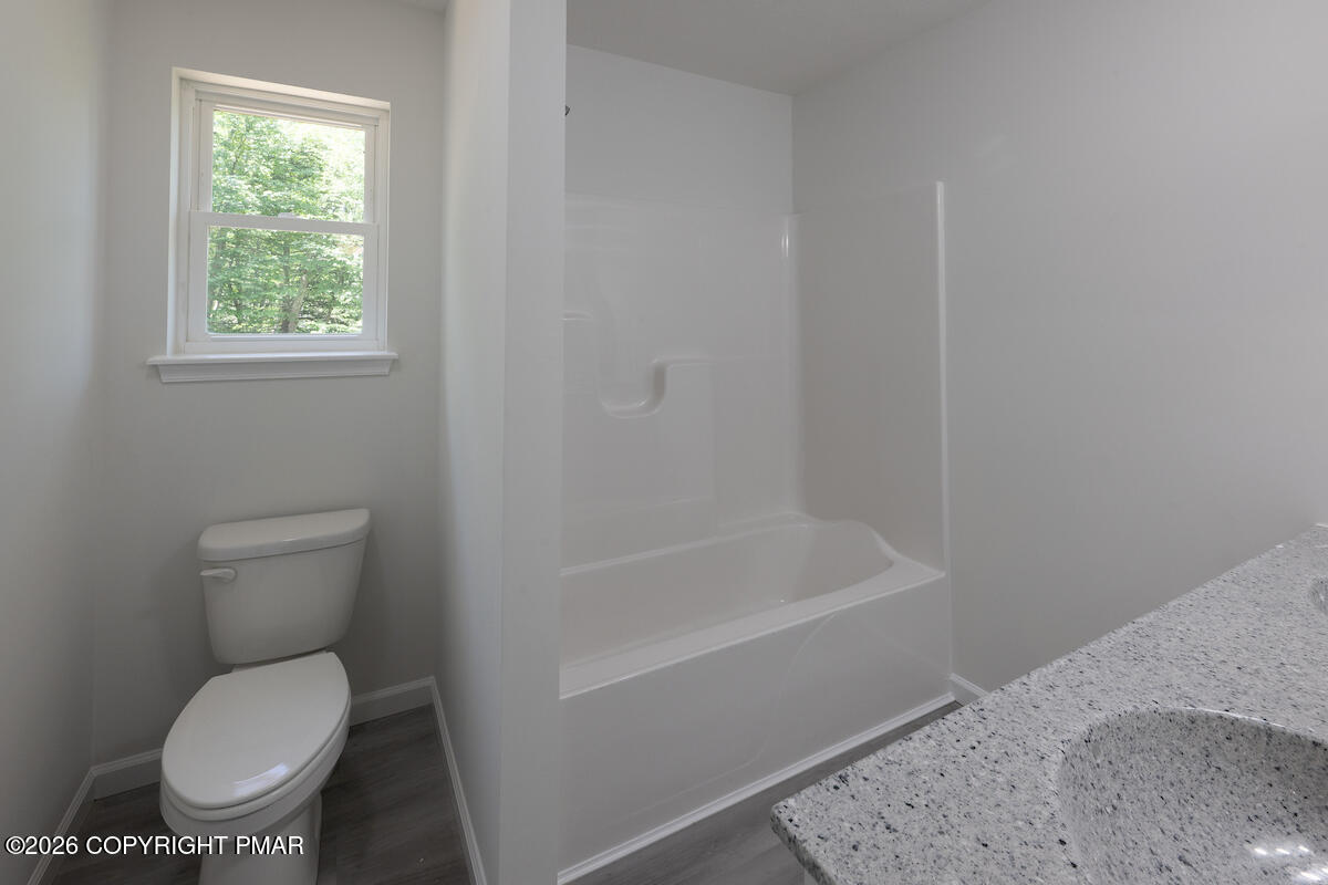 1125 Glouster Road, Unit 3209 Tobyhanna, PA 18466 - Photo 32 of 53 a white toilet sitting next to a bath tub