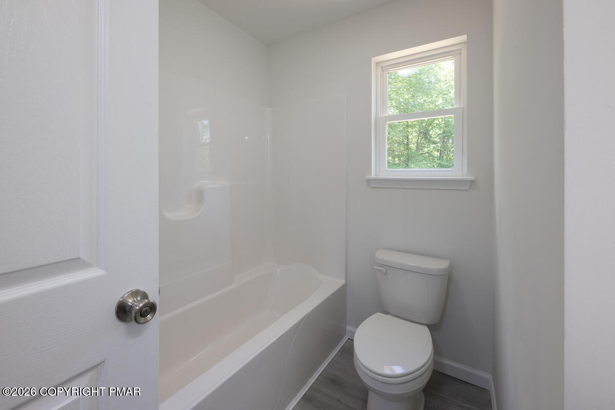 1125 Glouster Road, Unit 3209 Tobyhanna, PA 18466 - Photo 38 of 53 a white toilet sitting next to a tub