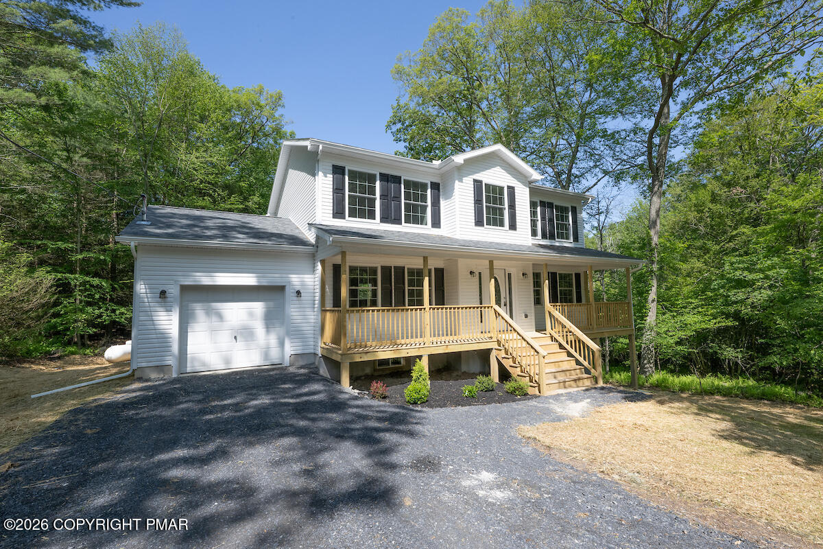 1125 Glouster Road, Unit 3209 Tobyhanna, PA 18466 - Photo 4 of 53 a front view of a house with a yard and garage