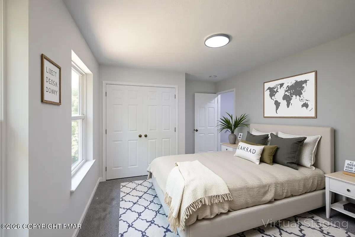 1125 Glouster Road, Unit 3209 Tobyhanna, PA 18466 - Photo 45 of 53 a bedroom with a large bed and a window