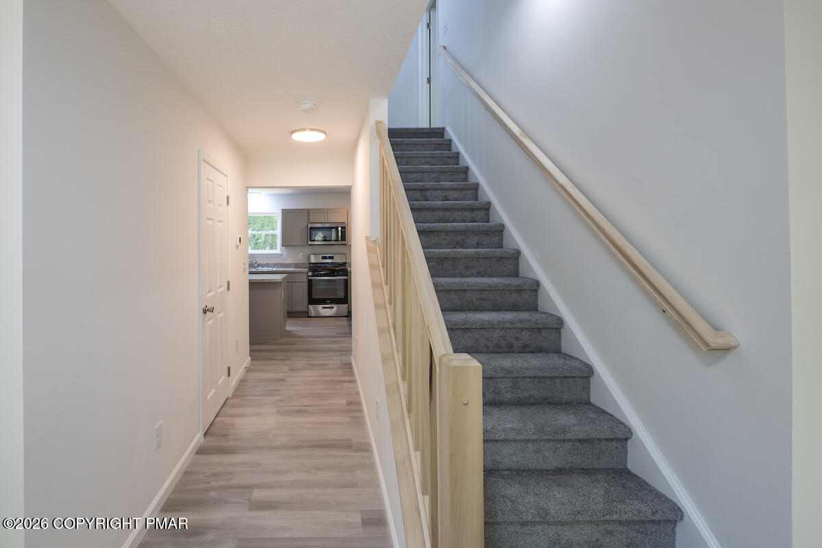 1125 Glouster Road, Unit 3209 Tobyhanna, PA 18466 - Photo 5 of 53 a view of entryway and hall with wooden floor