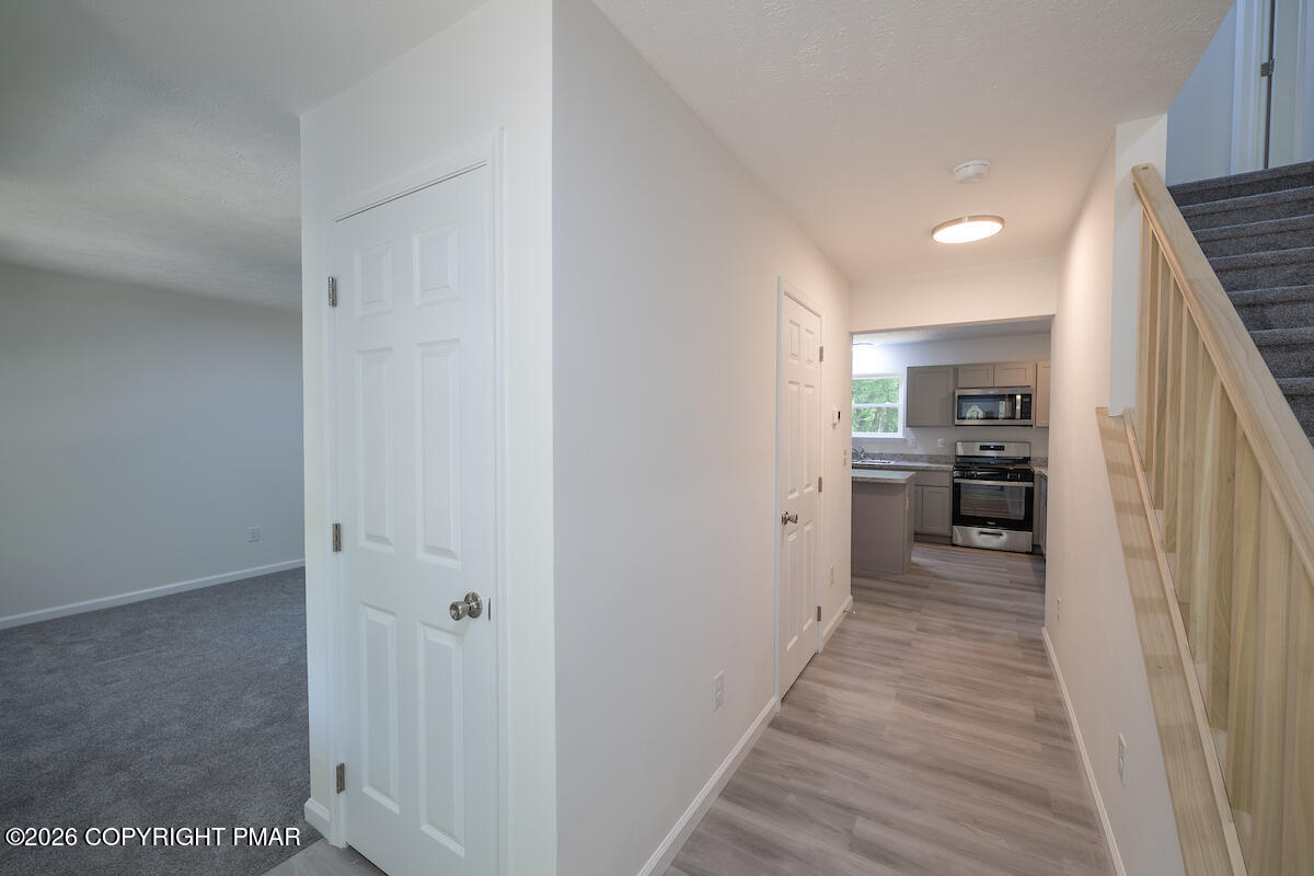 1125 Glouster Road, Unit 3209 Tobyhanna, PA 18466 - Photo 7 of 53 a view of a kitchen from the hallway