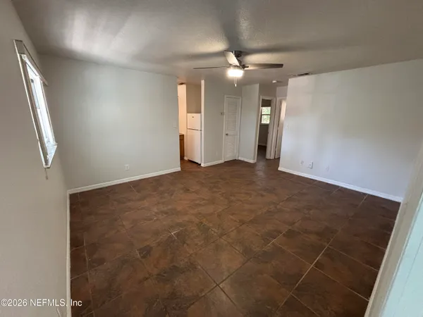 en empty room with an entryway and shower
