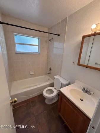 a bathroom with a sink a toilet and a bathtub