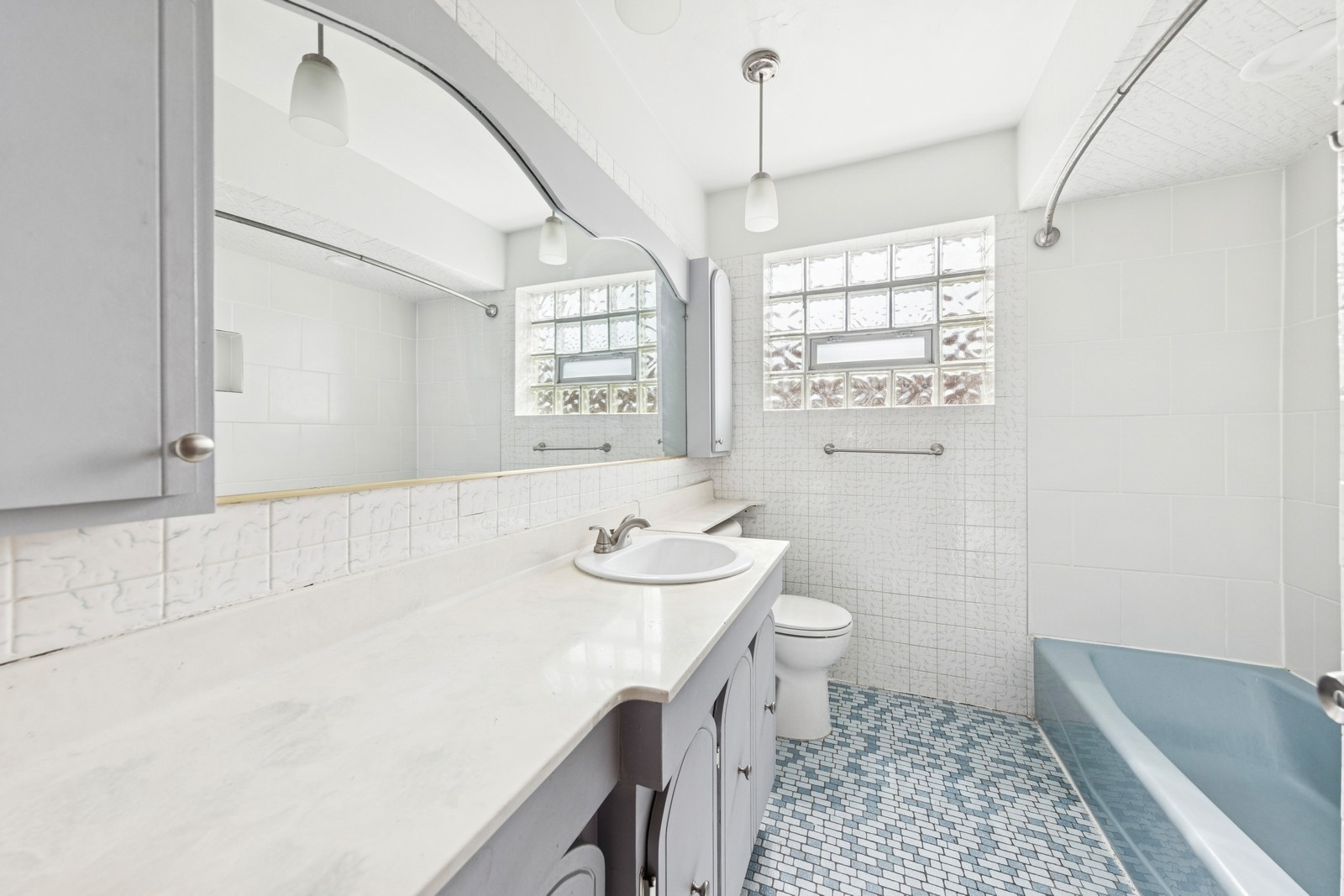 9331 South Pulaski Road Evergreen Park, IL 60805 - Photo 14 of 29 a spacious bathroom with a sink a toilet a mirror and shower