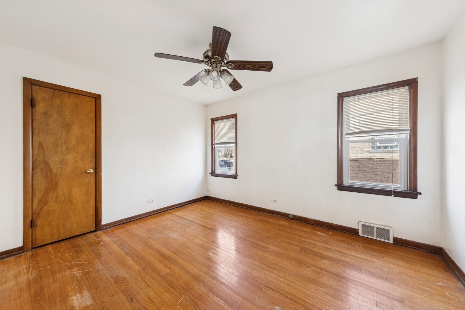 9331 South Pulaski Road Evergreen Park, IL 60805 - Photo 16 of 29 a view of an empty room with wooden floor and a window