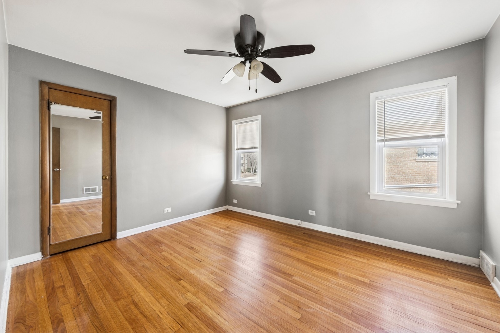 9331 South Pulaski Road Evergreen Park, IL 60805 - Photo 21 of 29 a view of empty room with wooden floor and fan