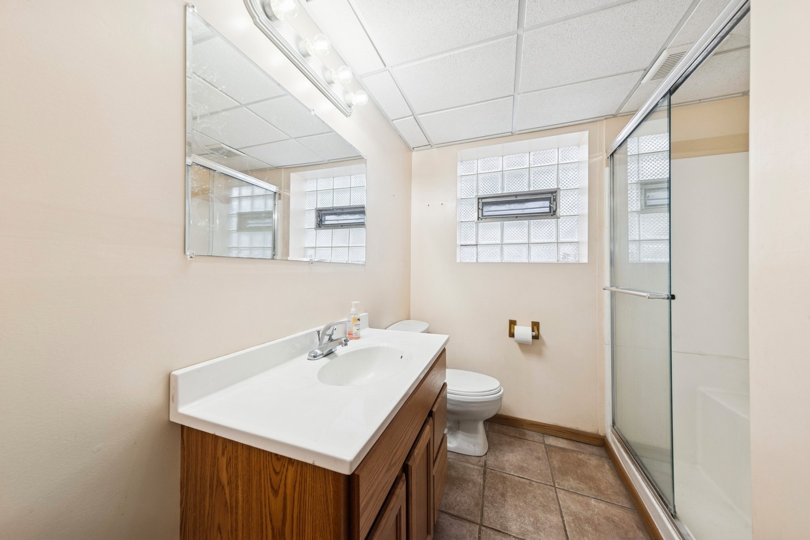 9331 South Pulaski Road Evergreen Park, IL 60805 - Photo 22 of 29 a bathroom with a sink a toilet and shower