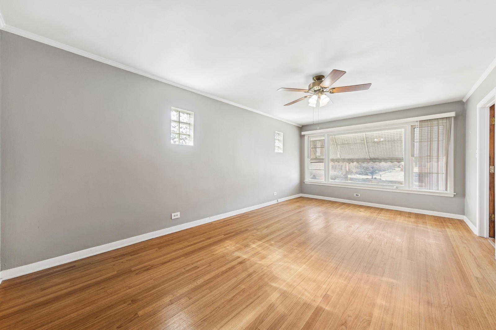 9331 South Pulaski Road Evergreen Park, IL 60805 - Photo 5 of 29 wooden floor in an empty room with a window