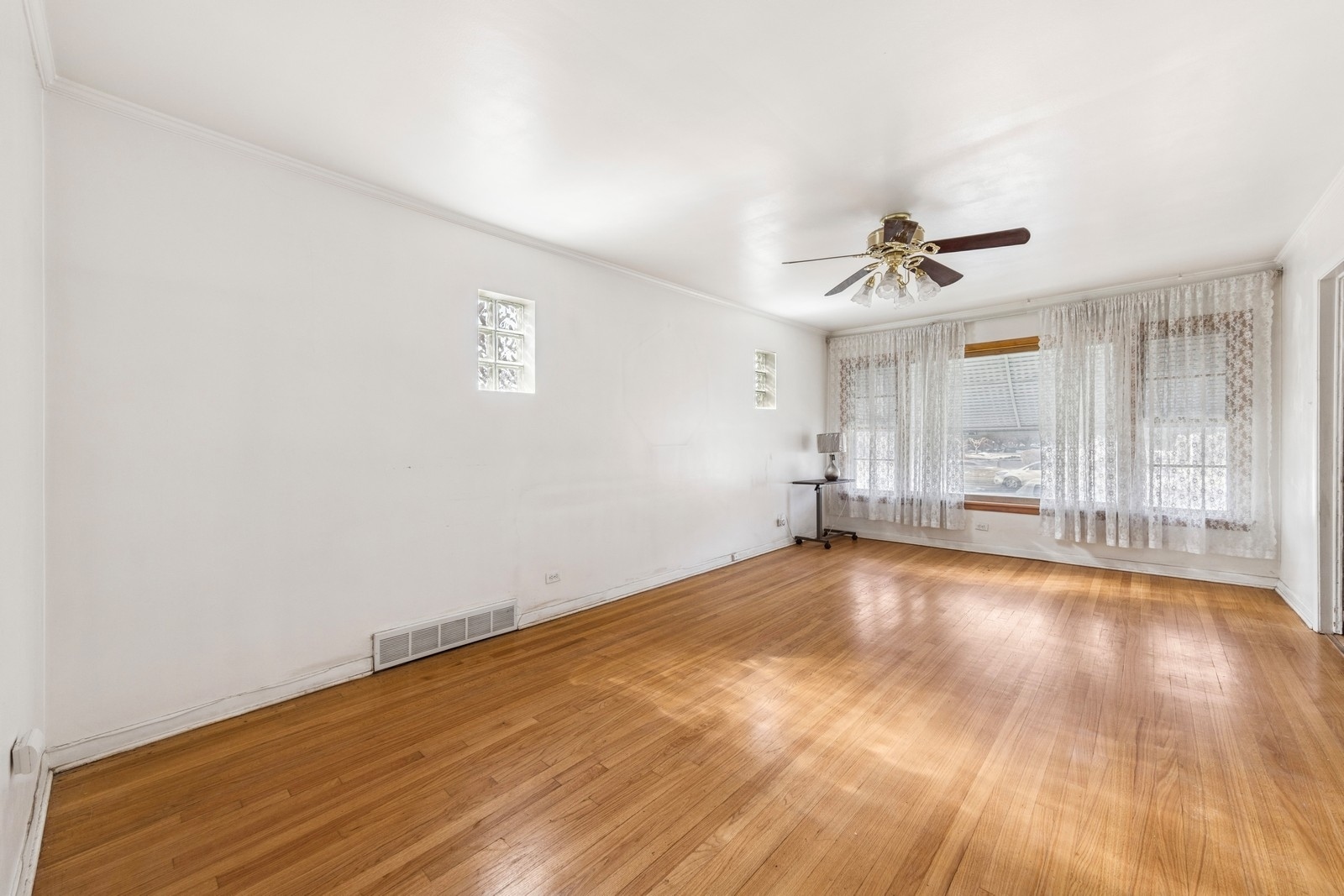 9331 South Pulaski Road Evergreen Park, IL 60805 - Photo 7 of 29 a view of empty room with wooden floor and fan