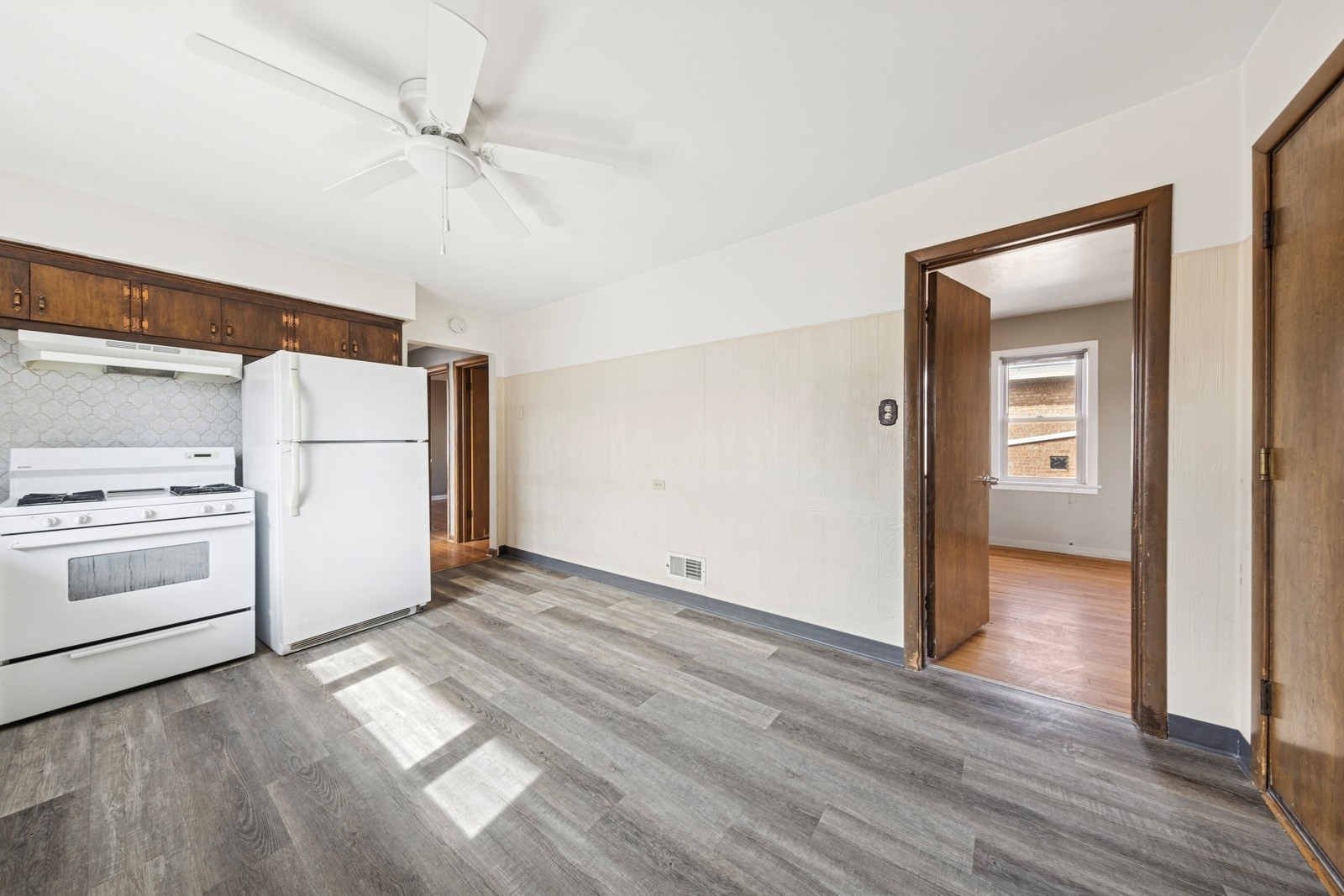 9331 South Pulaski Road Evergreen Park, IL 60805 - Photo 8 of 29 a view of a kitchen with wooden floor and electronic appliances