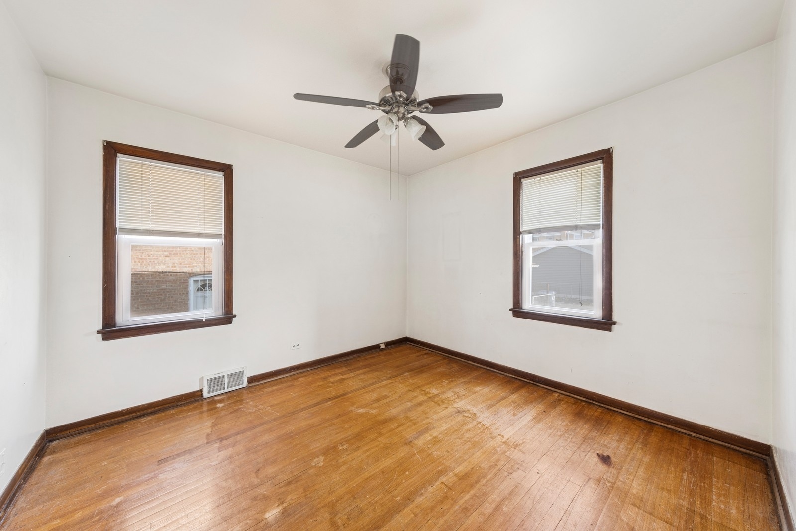 9331 South Pulaski Road Evergreen Park, IL 60805 - Photo 10 of 29 a view of an empty room with wooden floor and a window