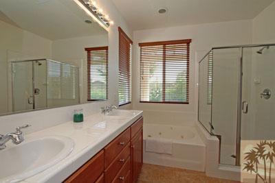 37430 Blackburn Road Indio, CA 92203 - Photo 11 of 17 a bathroom with a tub sink and mirror