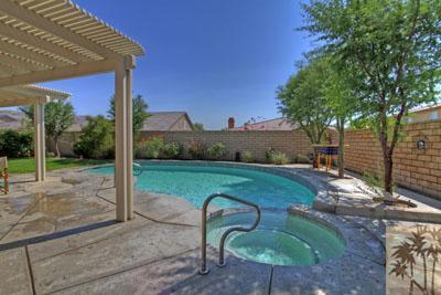37430 Blackburn Road Indio, CA 92203 - Photo 2 of 17 a backyard of a house with table and chairs
