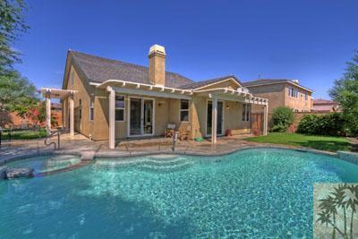 37430 Blackburn Road Indio, CA 92203 - Photo 3 of 17 a front view of a house with swimming pool and porch with furniture