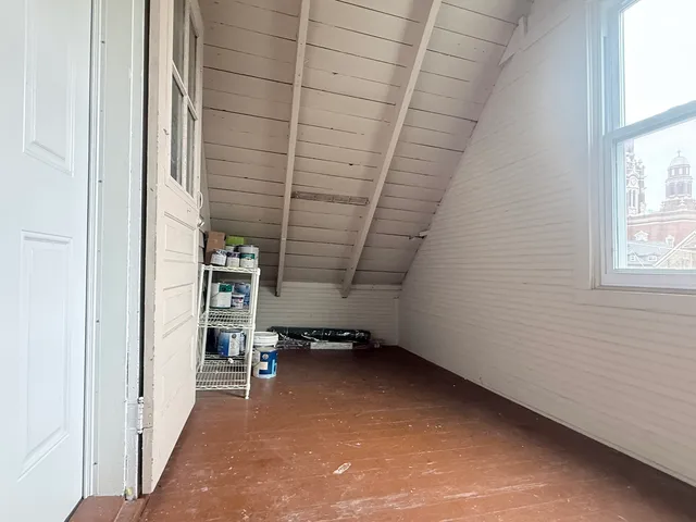 a view of room with stairs and a window