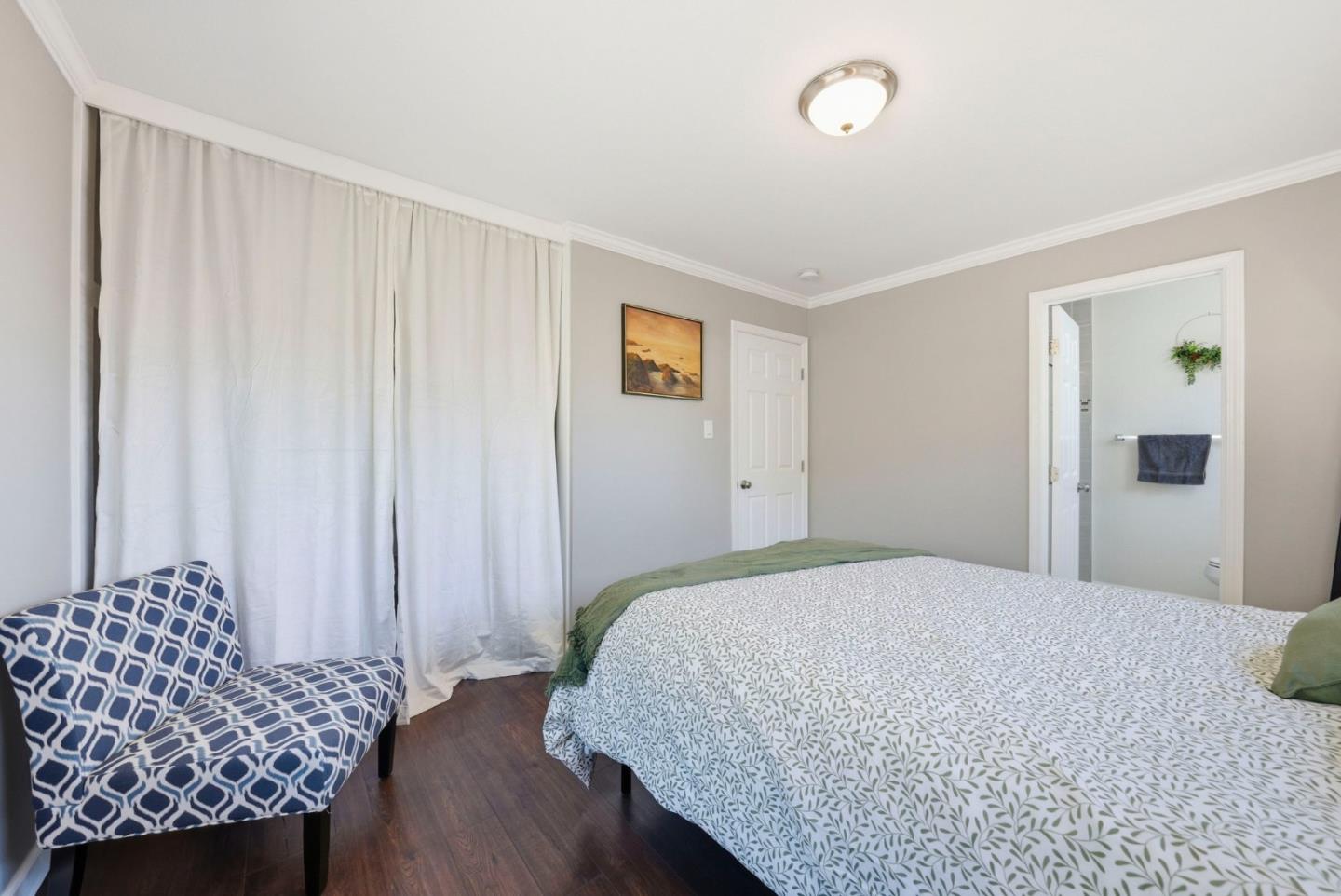 2793 Ruff Court Pinole, CA 94564 - Photo 29 of 53 a bedroom with a bed and a chair