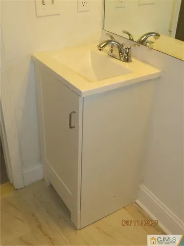 a bathroom with a sink and toilet