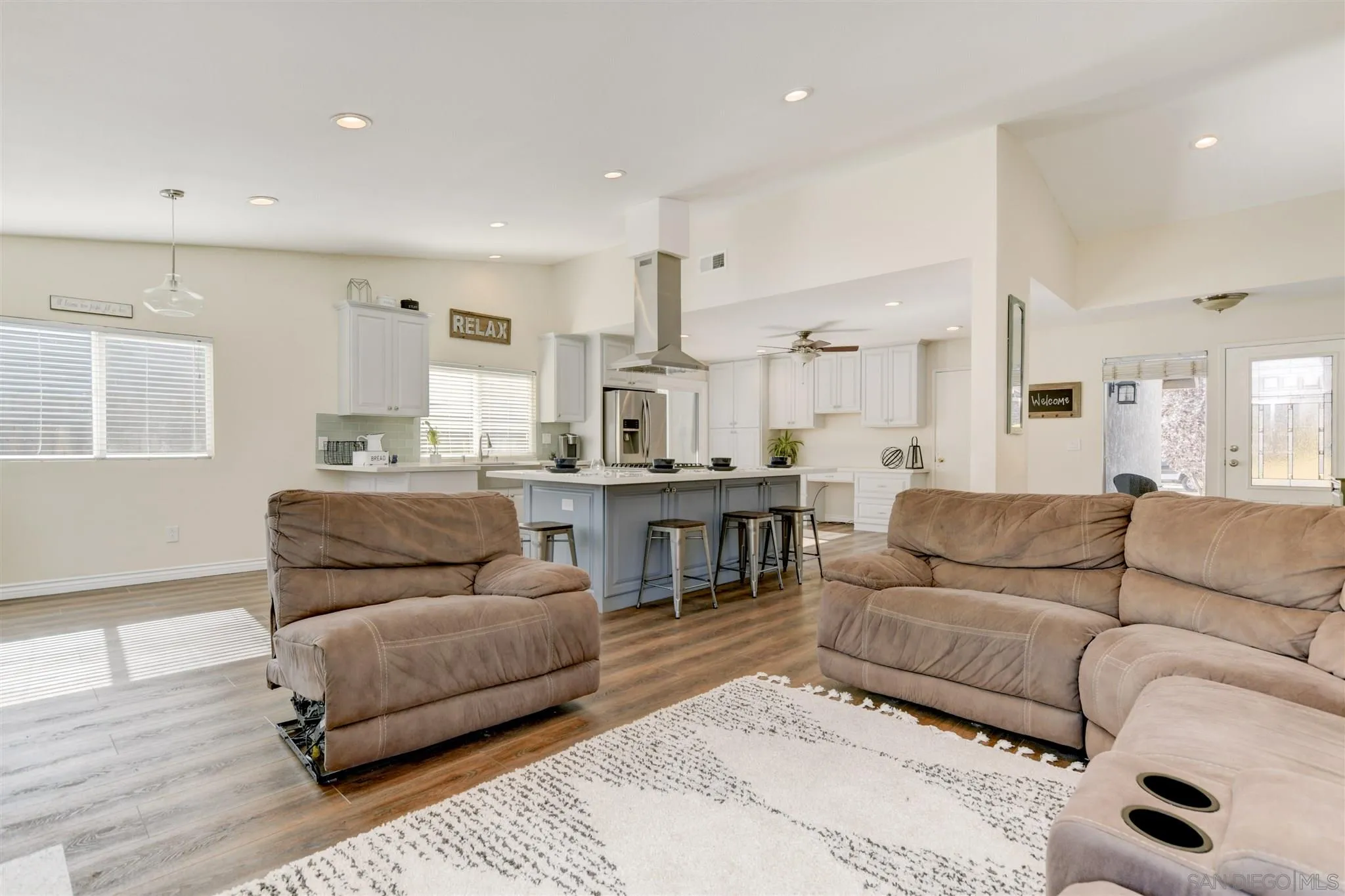 9317 Lake Country Drive Santee, CA 92071 - Photo 12 of 32 a living room with furniture and kitchen view