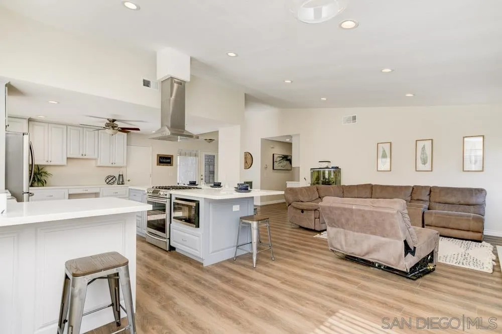 9317 Lake Country Drive Santee, CA 92071 - Photo 18 of 32 a living room with furniture and a kitchen view