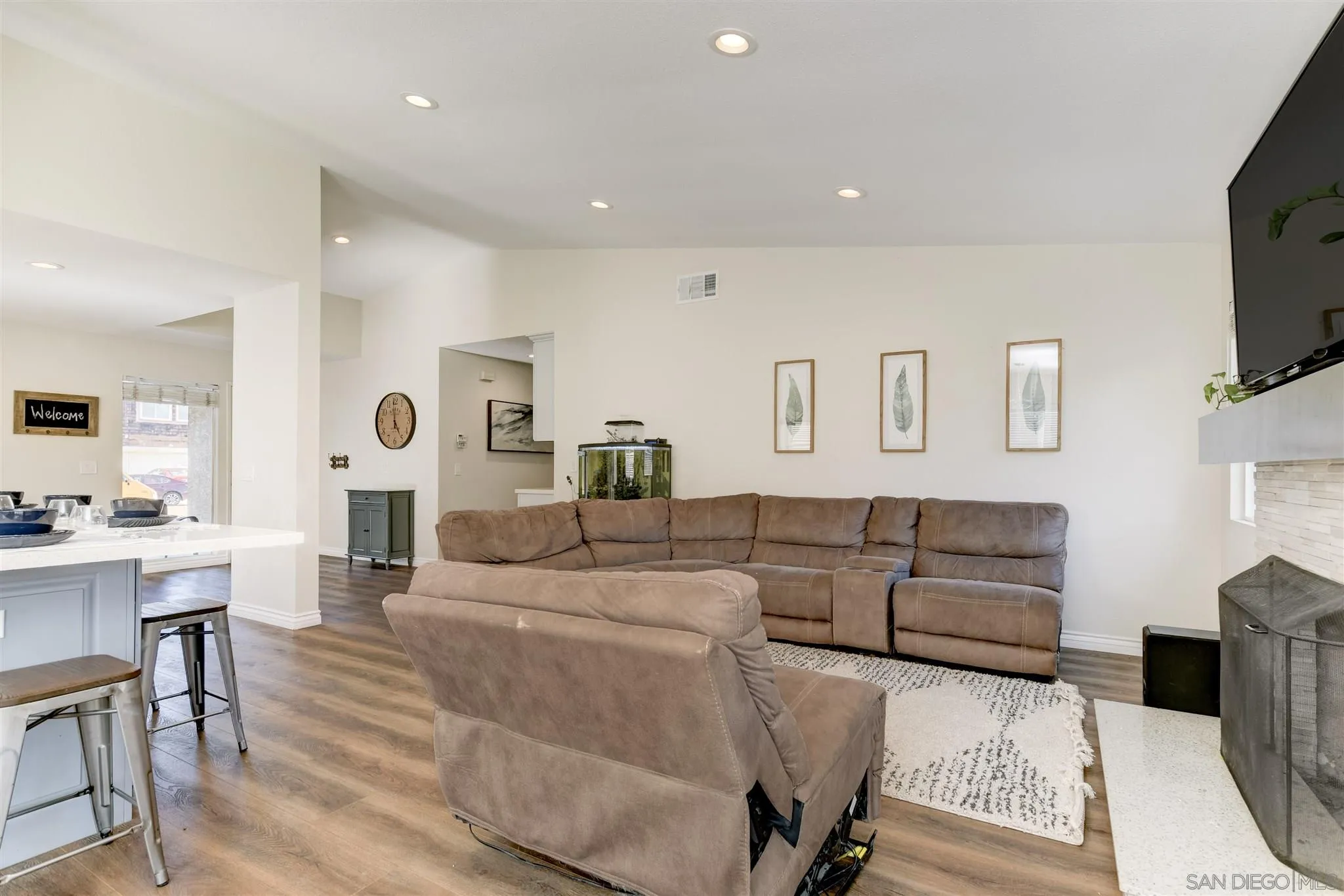 9317 Lake Country Drive Santee, CA 92071 - Photo 19 of 32 a living room with furniture a flat screen tv and kitchen view