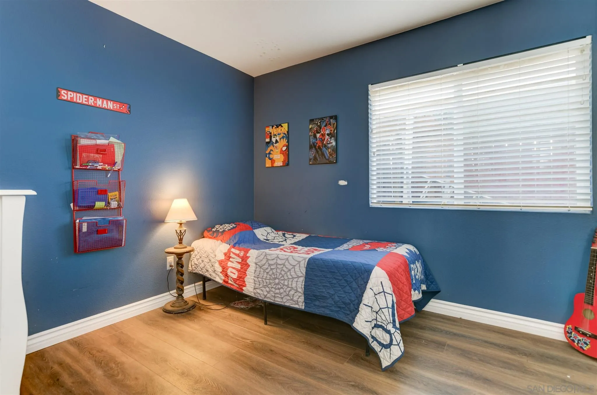 9317 Lake Country Drive Santee, CA 92071 - Photo 25 of 32 a bed sitting in a bedroom next to a window