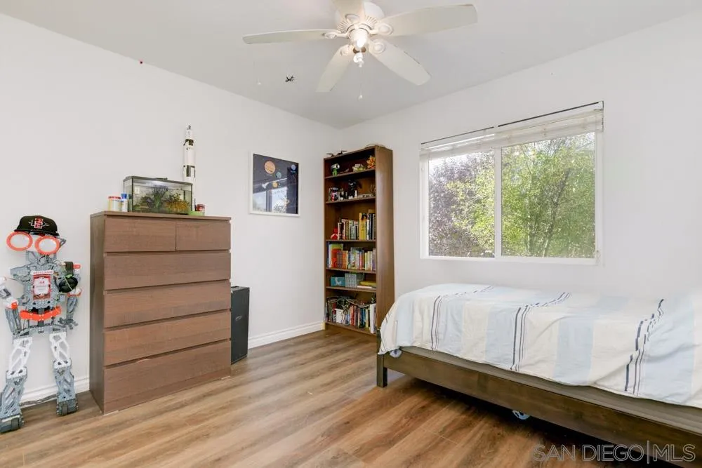 9317 Lake Country Drive Santee, CA 92071 - Photo 26 of 32 a bedroom with a bed and a window