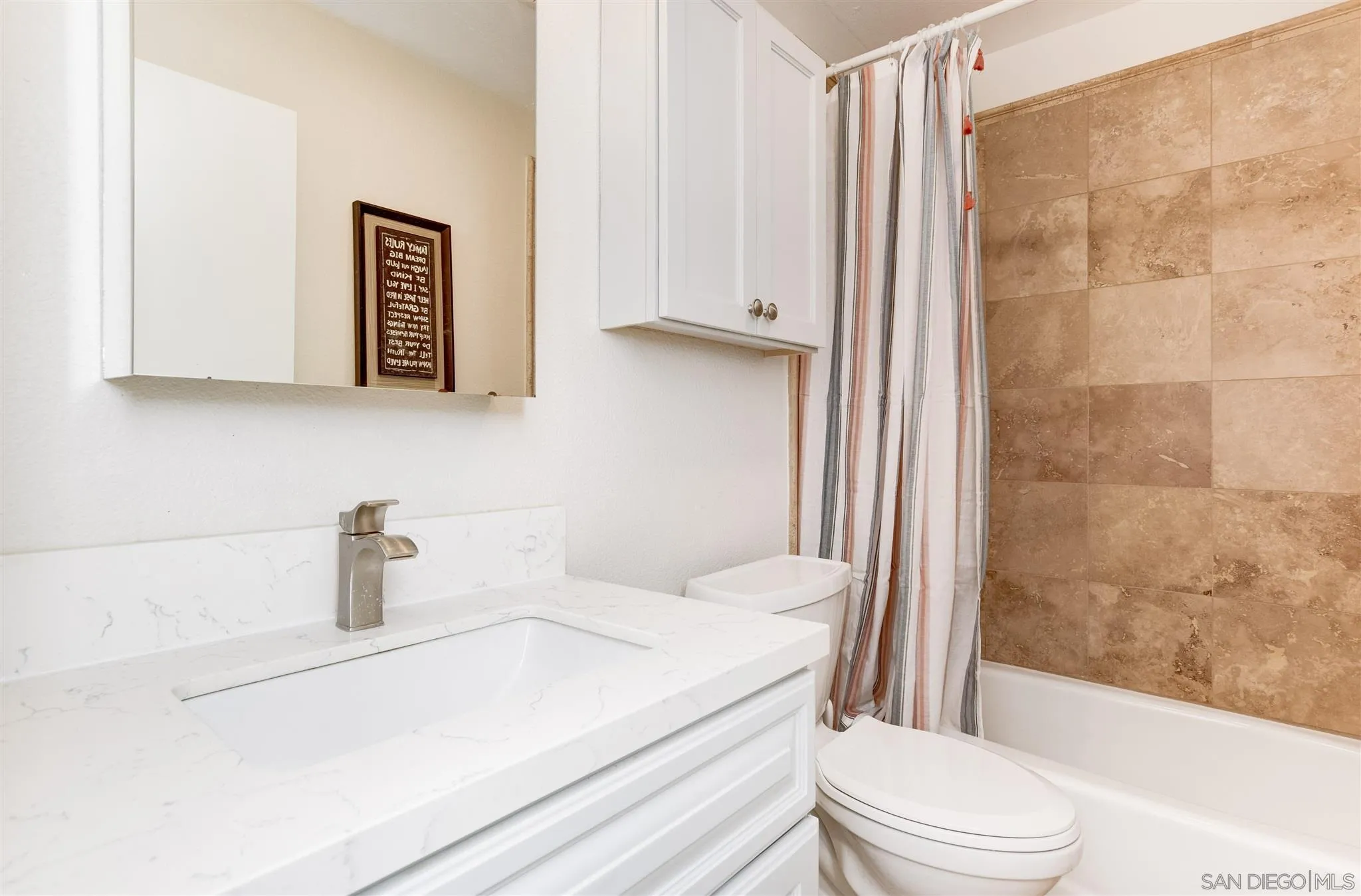 9317 Lake Country Drive Santee, CA 92071 - Photo 27 of 32 a bathroom with a sink toilet and shower