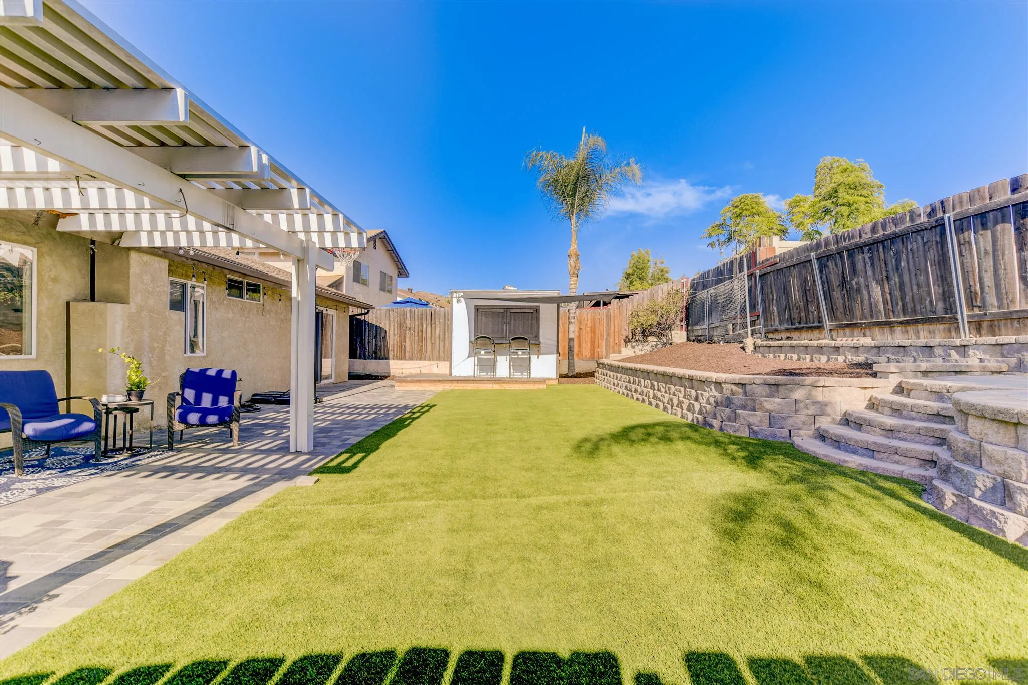 9317 Lake Country Drive Santee, CA 92071 - Photo 31 of 32 a swimming pool with outdoor seating and yard