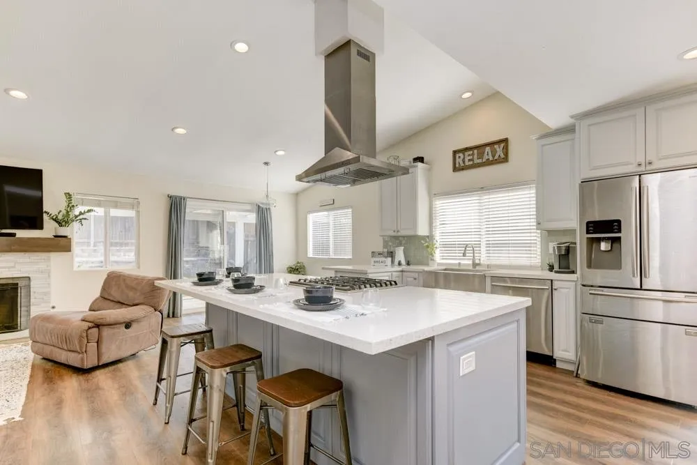 9317 Lake Country Drive Santee, CA 92071 - Photo 6 of 32 a kitchen with a sink stainless steel appliances and cabinets
