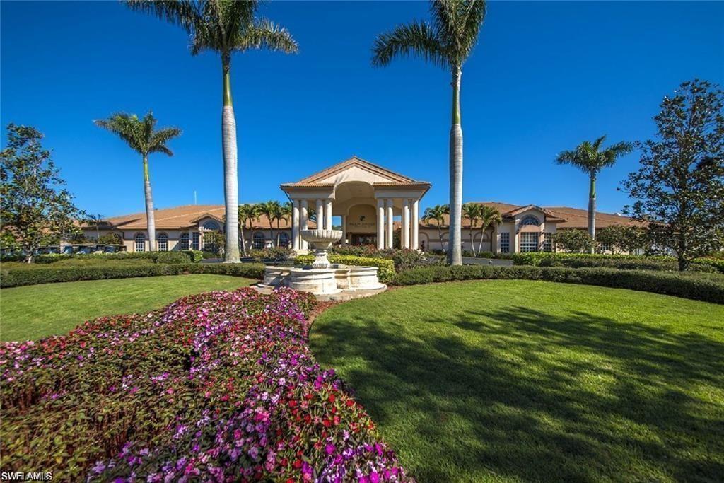 5706 Lago Villaggio Way Naples, FL 34104 - Photo 26 of 32 a garden view with a fountain