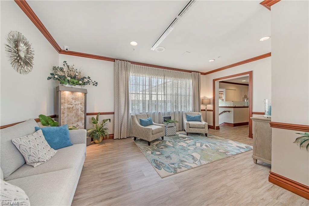 5706 Lago Villaggio Way Naples, FL 34104 - Photo 28 of 32 a living room with furniture or couch and a window