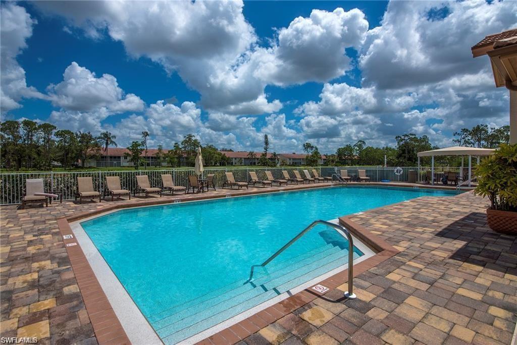 5706 Lago Villaggio Way Naples, FL 34104 - Photo 30 of 32 a view of a swimming pool
