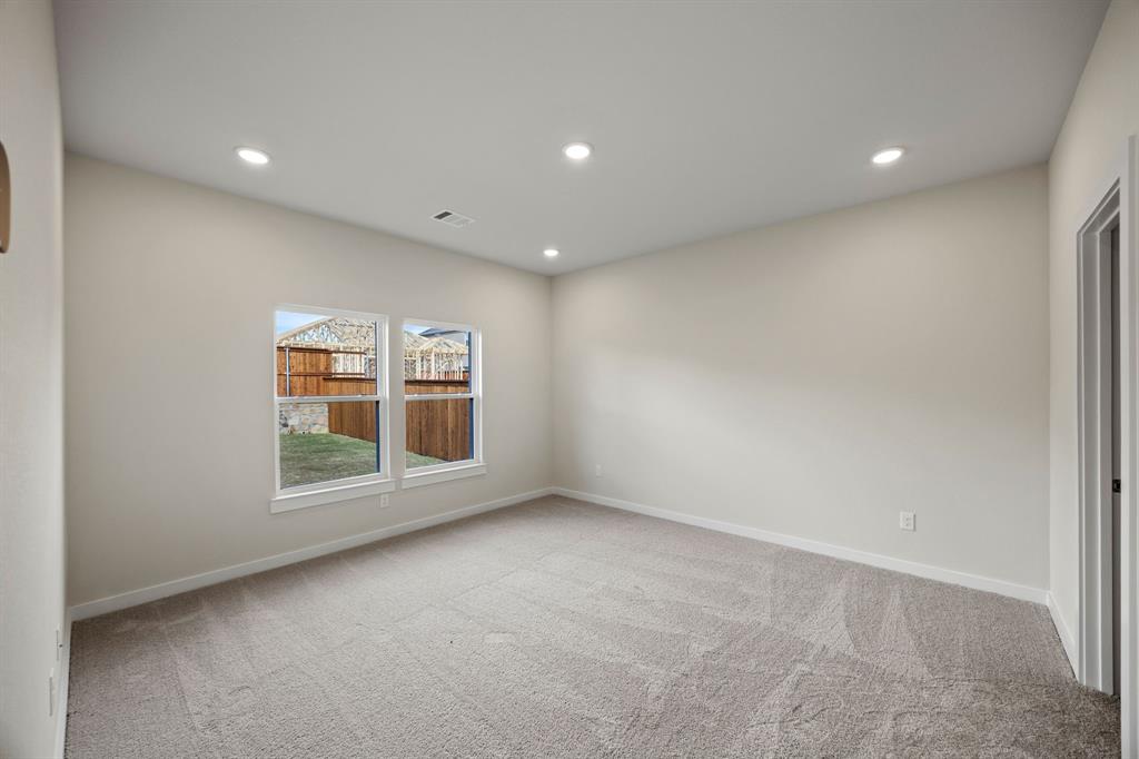 731 Carson Drive Forney, TX 75126 - Photo 6 of 31 a view of an empty room with a window