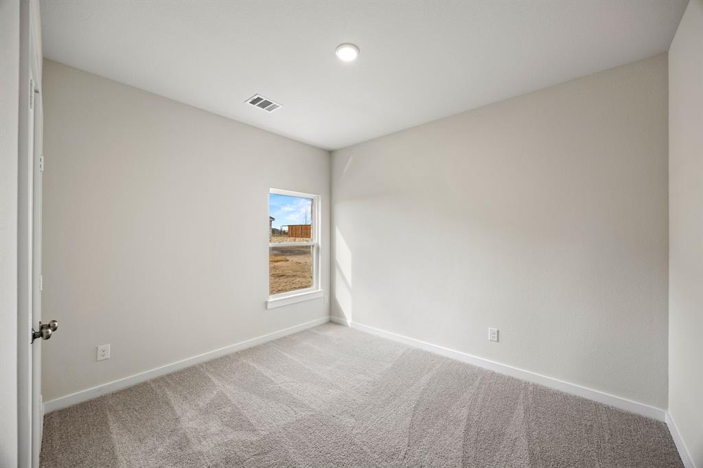 731 Carson Drive Forney, TX 75126 - Photo 9 of 31 a view of an empty room with a window