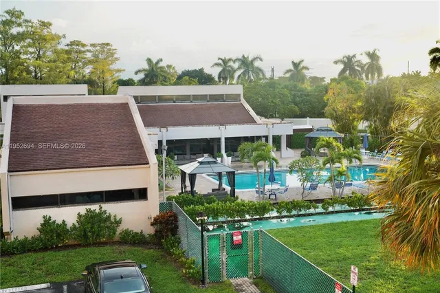 a aerial view of a house with a yard