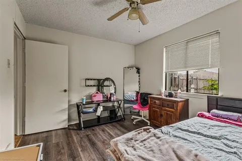 a bedroom with bed and a window