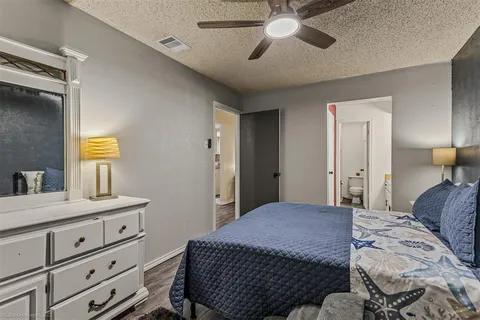 a bedroom with a bed and a dresser