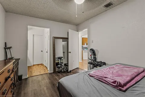 a bedroom with a bed and a dresser